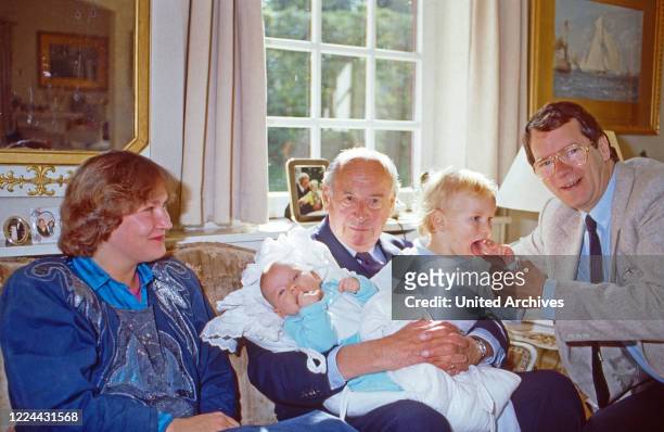 Princess Nina, nee von Reventlow, and grandfather Louis Ferdinand Prince of Prussia caressing his grandchildren Princess Irina and Christian Ludwig,...