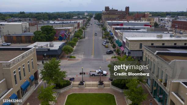 Vehicles sit parked on Poyntz Avenue in this aerial photograph taken in downtown Manhattan, Kansas, U.S., on Thursday, July 2, 2020. Kansas' top...