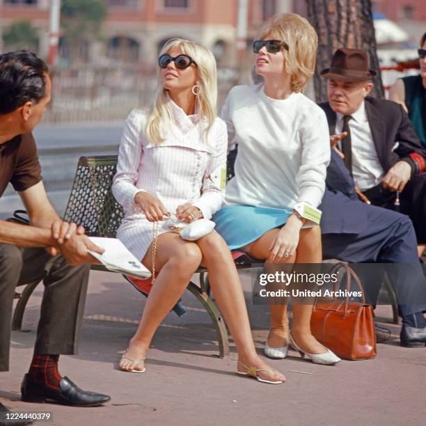 Swedish actress Britt Ekland and friend watching the Grand Prix of Monaco, 1966.