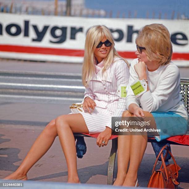 Swedish actress Britt Ekland and friend watching the Grand Prix of Monaco, 1966.