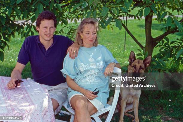 Wilhelm Albert Prince von Urach, Count of Wurttemberg, with his wife Karen, nee von Brauchitsch, with German Shepherd dog at Lichtenstein castle,...