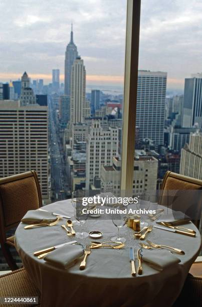 Small dining room of Adnan Kashoggi with view to the Empire State Building at Olympic Tower in New York, USA 1986.
