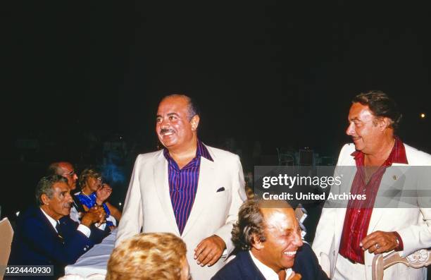 Adnan Khashoggi at an evening event with Alfonso Prince of Hohenlohe Langenburg in Marbella, Spain, 1985.