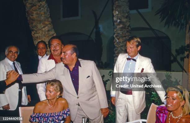 Adnan Khashoggi at an evening event with Alfonso Prince of Hohenlohe Langenburg in Marbella, Spain, 1985.