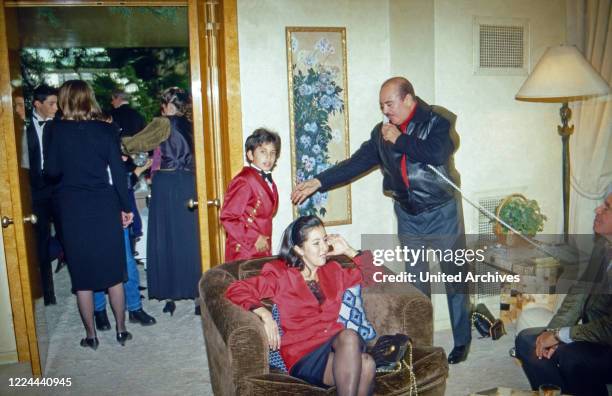 Arab business man Adnan Kashoggi with son Ali while a phone call at New York, USA 1986.