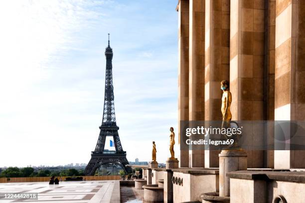 eiffel tower and trocadero empty during pandemic covid 19 in europe. - france coronavirus stock pictures, royalty-free photos & images