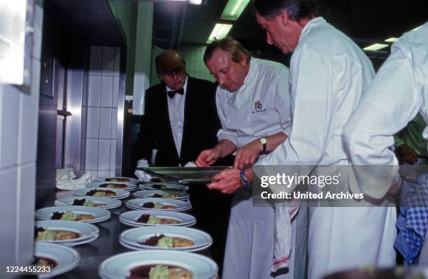 Star chef Alfons Schuhbeck cooking while a royal visit of Prince Charles in Germany, 2004.