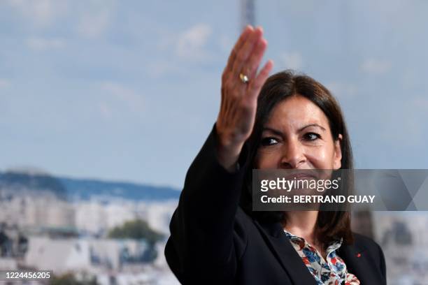 Paris' Mayor Anne Hidalgo reacts, during a Paris council meeting on July 3, 2020 at the Paris city hall, as she arrives on stage following her...