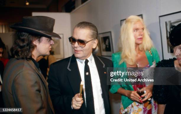 Karl Lagerfeld with singer Udo Lindenberg and Gunilla von Bismarck at the opening of his photography exhibition "Parade" at Museum fuer moderne Kunst...