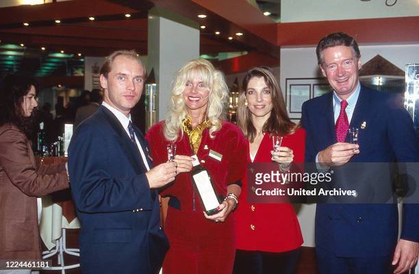 Count Maximilian von Bismarck and Gunilla with his product, the Bismarck Korn schnaps at Ohe near Hamburg, Germany, 1990.