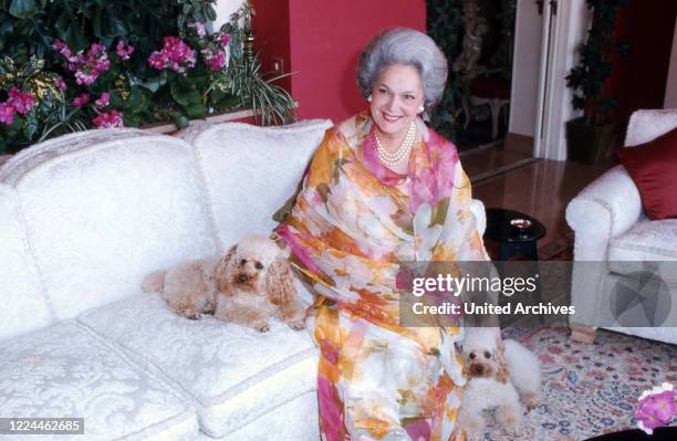 Begum Om Habibeh Aga Khan with her poodles at her house in Le Cannet, France 1985.