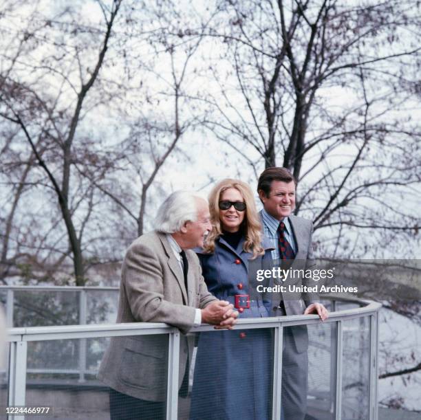 American senator Edward Ted Kennedy and his wife Joan meeting orchestra conductor Arthur Fiedler while visiting Bonn, Germany, 1971.