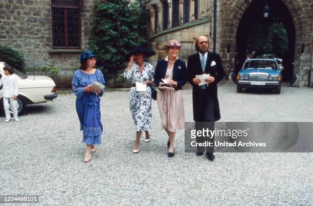Guest of the wedding of heir to the throne Ernst August von Hanover with Chantal Hochuli at Marienburg castle near Hanover, Germany, 1981.