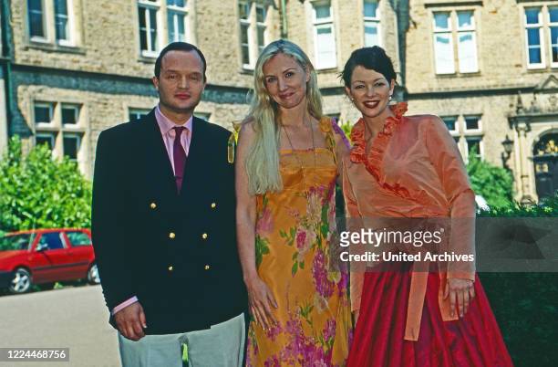 Alexander Prince of Schaumburg Lippe with fashion designer Jette Joop and presenter Annika de Buhr at Bueckeburg, Germany, 2002.