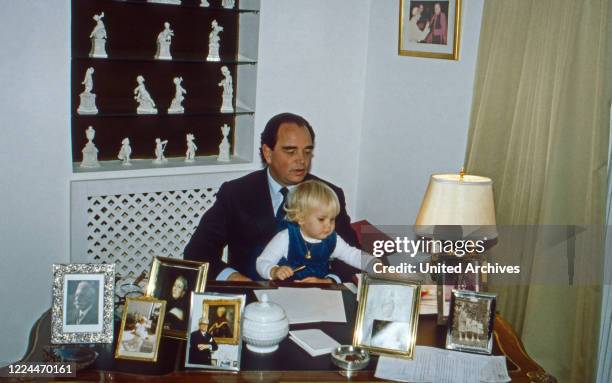 Rudolf Count of Schoenburg Glauchau playing with his daughter Sophie, Germany, 1983.