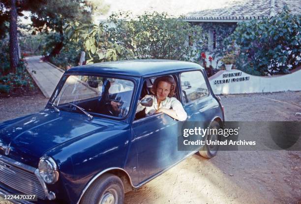 Marie Louise Princess von Schoenburg Glauchau, nee of Prussia, with her Austin Mini Cooper at Marbella, Spain, 1983.