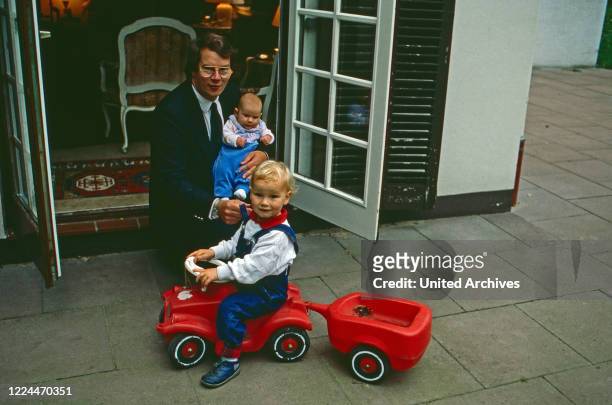 Christian Sigismund Prince of Prussia with his children Irina and Christian Ludwig playing in the terrace, Germany, 1989.