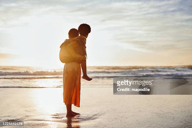 the sun will never set on their bond - african girls on beach stock pictures, royalty-free photos & images