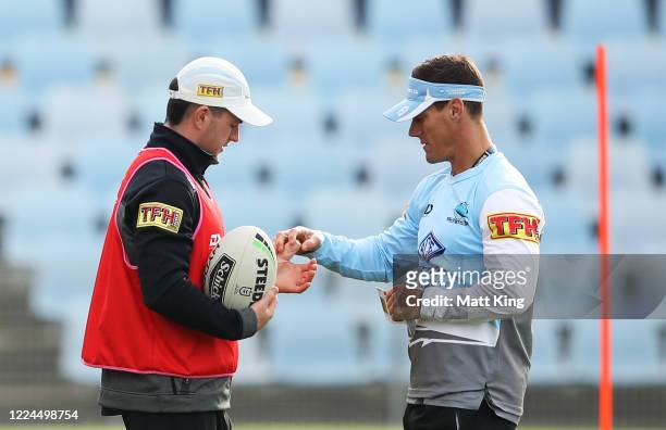 Chad Townsend talks to Sharks coach John Morris during a Cronulla Sharks NRL training session at Shark Park on May 13, 2020 in Sydney, Australia.