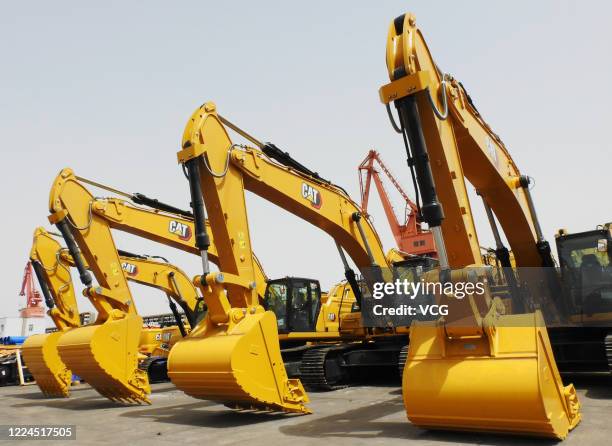 Construction machines from Caterpillar Inc. Stand ready for shipment at Lianyungang port on May 13, 2020 in Lianyungang, Jiangsu Province of China.