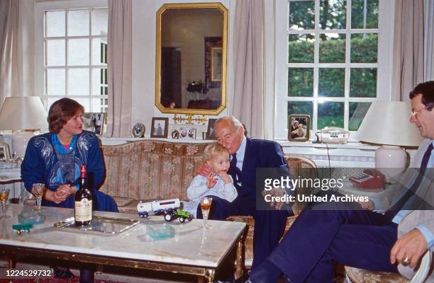 Princess Nina, nee von Reventlow, and grandfather Louis Ferdinand Prince of Prussia caressing his grandchildren Princess Irina and Christian Ludwig,...