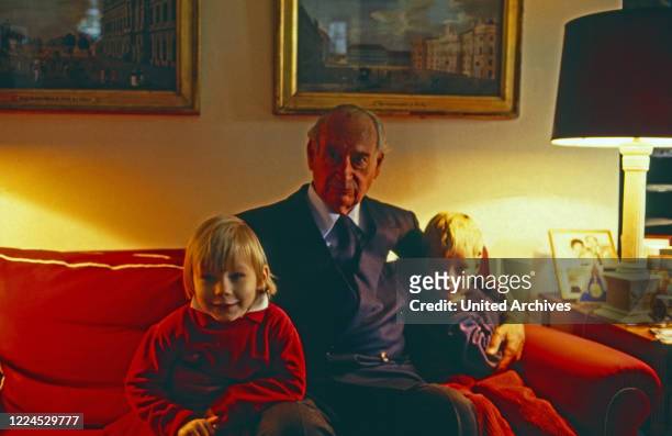 Grandfather Louis Ferdinand Prince of Prussia caressing his grandchildren Princess Irina and Christian Ludwig, Germany, 1991.
