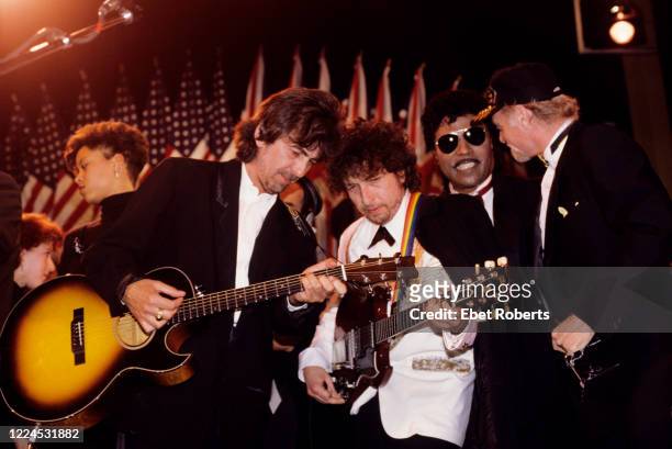 George Harrison, Bob Dylan, Little Richard and Mike Love of The Beach Boys performing at the 1988 Rock & Roll Hall Of Fame awards ceremony at the...