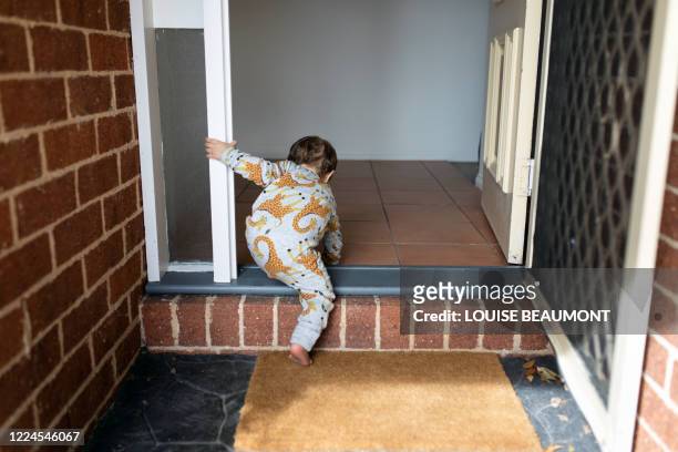 toddler at home - welcome mat stock pictures, royalty-free photos & images