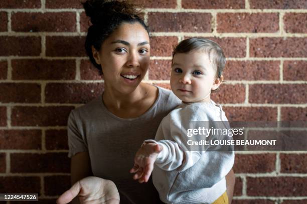 mum and daughter at home - family smiling at front door stock pictures, royalty-free photos & images