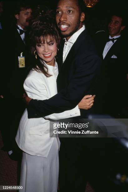 American singer and dancer Paula Abdul embracing American singer�songwriter Jeffrey Osborne at the National Academy of Popular Music's Songwriters...