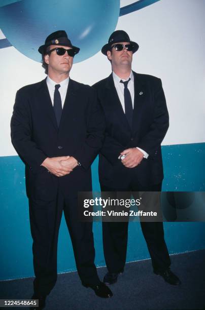 American actor Jim Belushi and Canadian actor and comedian Dan Aykroyd, in costume as the Blues Brothers, attend 10th Annual Comic Relief Benefit,...