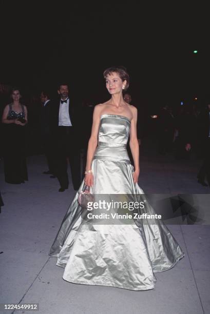 American actress Joan Allen, wearing a full-length silver evening gown, attends the Vanity Fair Oscars Party, following the 68th Annual Academy...