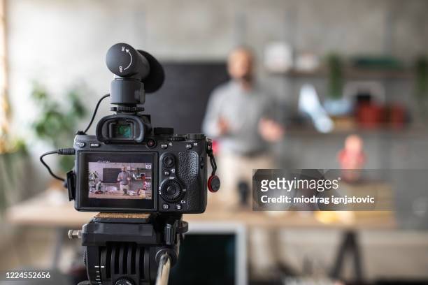 teacher recording video for e-learning class - filming stock pictures, royalty-free photos & images