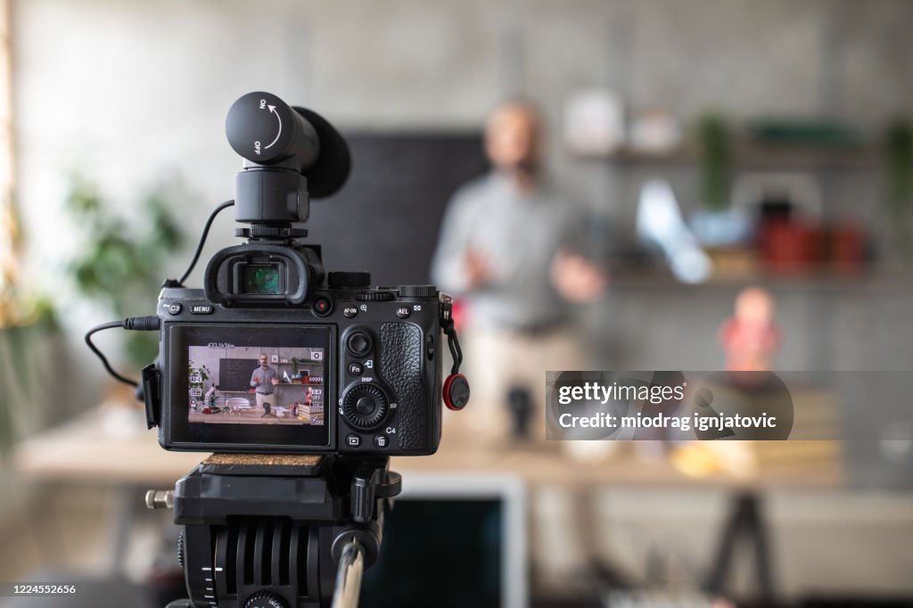 Teacher recording video for e-learning class