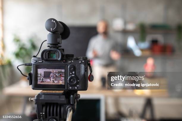 teacher recording video for e-learning class - câmara de vídeo imagens e fotografias de stock