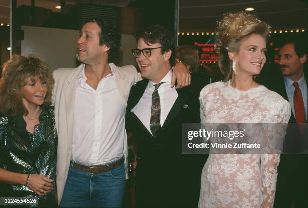 Jayni Chase with her husband, American actor and comedian Chevy Chase, Canadian actor and comedian Dan Akroyd, and his wife, American actress Donna...