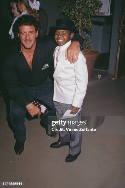 American football player Lyle Alzado with American actor Gary Coleman attend the grand opening of Alzado's, his restaurant in West Hollywood,...