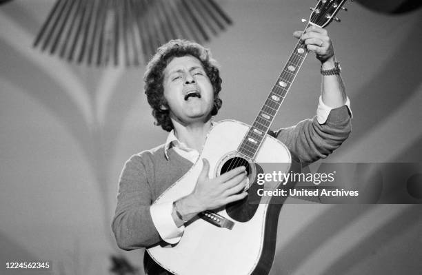 French chanson singer Joe Dassin performing at Germany, circa 1970.