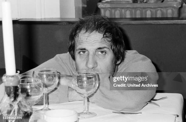 Italian singer and actor Adriano Celentano visiting an Italian restaurant at Hamburg, Germany circa 1982.