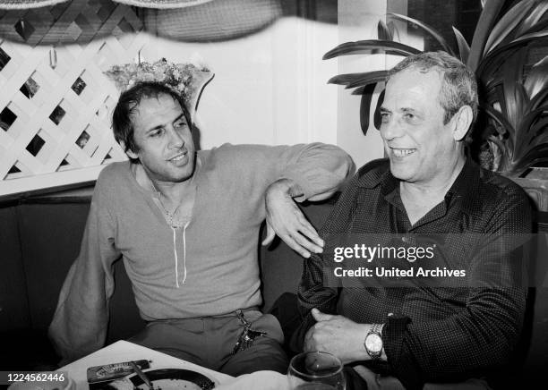 Italian singer and actor Adriano Celentano visiting an Italian restaurant at Hamburg, Germany circa 1982.