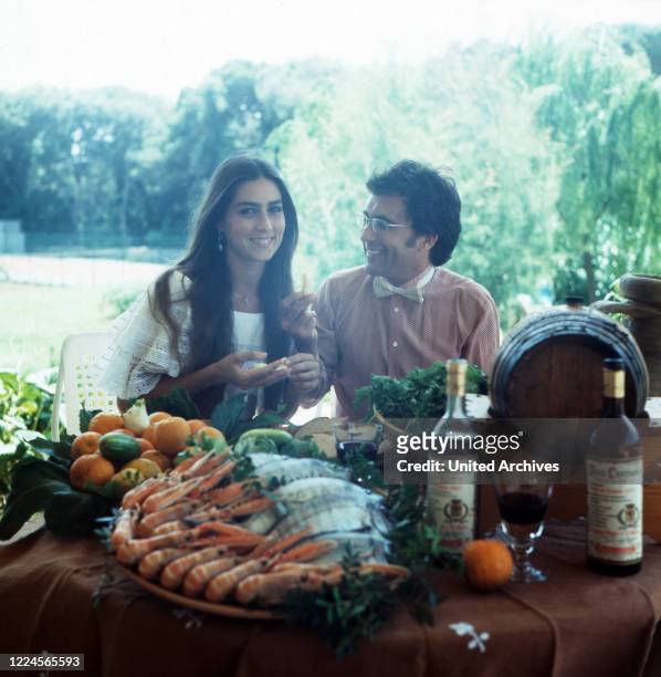 Homestory of the Italian-American singer and actress Romina Power with husband and singer Al Bano Carrisi at a decadent lunch, Italy mid 1980s.