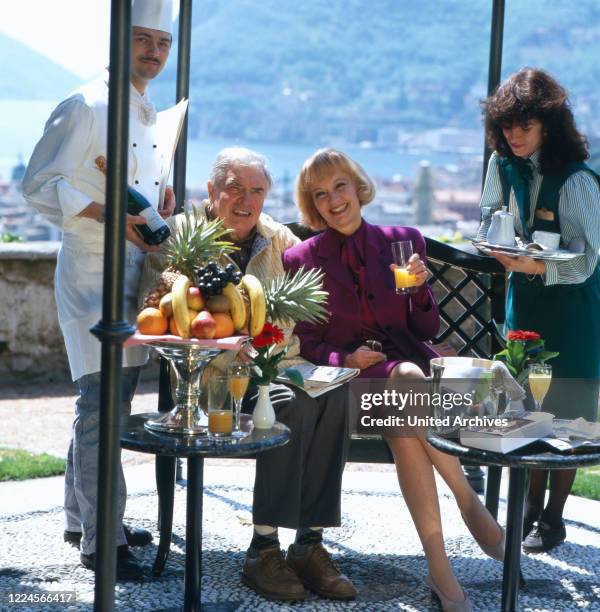 Swiss actress Liselotte Pulver together with his husband Helmut Schmid an eployees, Como Italy 1980.