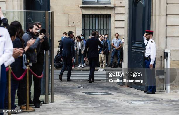 Edouard Philippe, France's former prime minister, center, departs following a handover ceremony at the Hotel de Matignon, the official residence of...