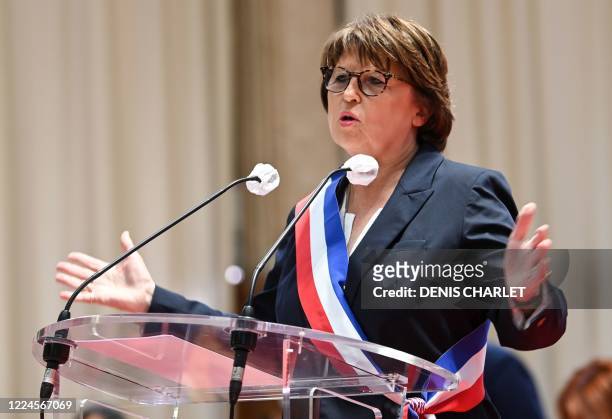 Former first secretary of the French Socialist Party and mayor of Lille Martine Aubry delivers a speech after receiving her mayor's sash during the...