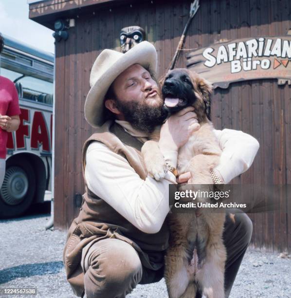 German bass singer Ivan Rebroff poses with animals in Safariland Gross-Gerau near Wallerstädten, Germany in the early 1980s.