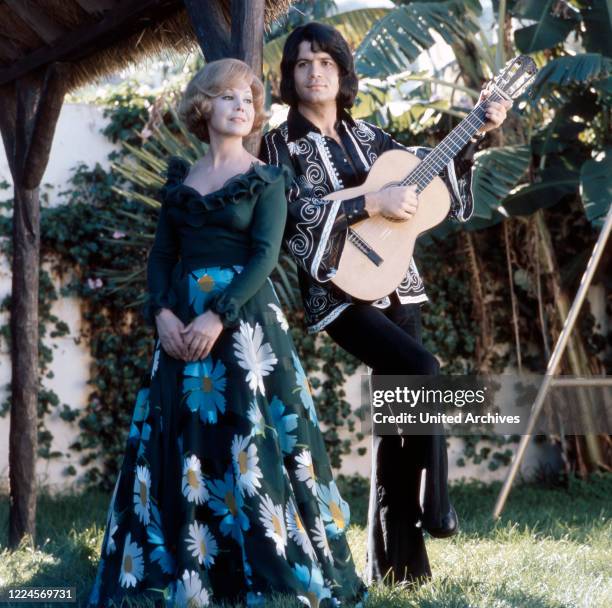 German opera singer Anneliese Rothenberger shooting a song with German pop singer Costa Cordalis, 1970s.