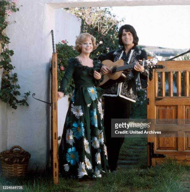 German opera singer Anneliese Rothenberger shooting a song with German pop singer Costa Cordalis, 1970s.