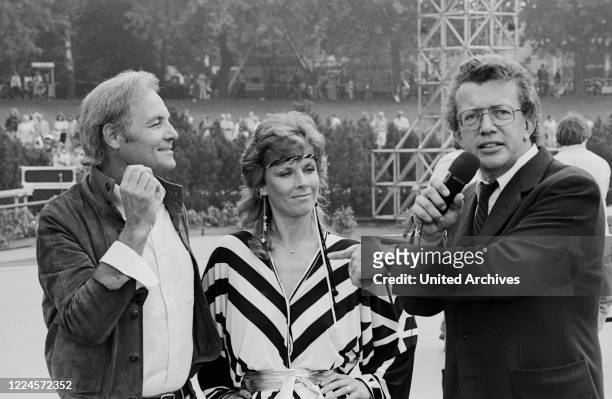 German schlager singer and actress Heidi Bruehl with Harry Valerien and Dieter Thomas Heck, Germany early 1980s.