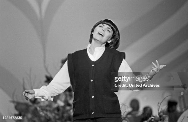 French singer Mireille Mathieu performing on German TV, Germany circa 1981.