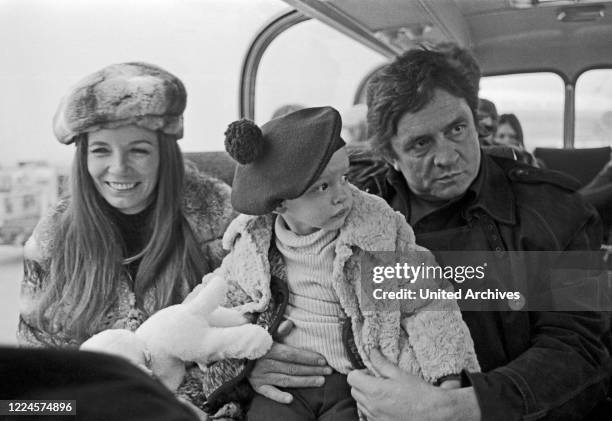 American country singer and song writer Johnny Cash with his wife June Carter Cash and son John Carter Cash at Hamburg, Germany, circa 1981.